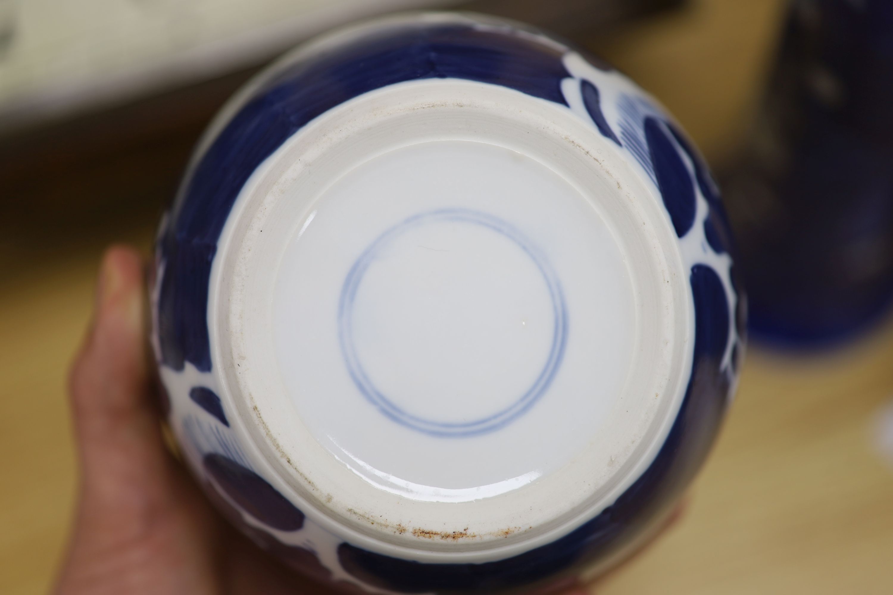 Two Chinese blue and white prunus pattern ginger jars and a similar cylinder vase, tallest 26cm